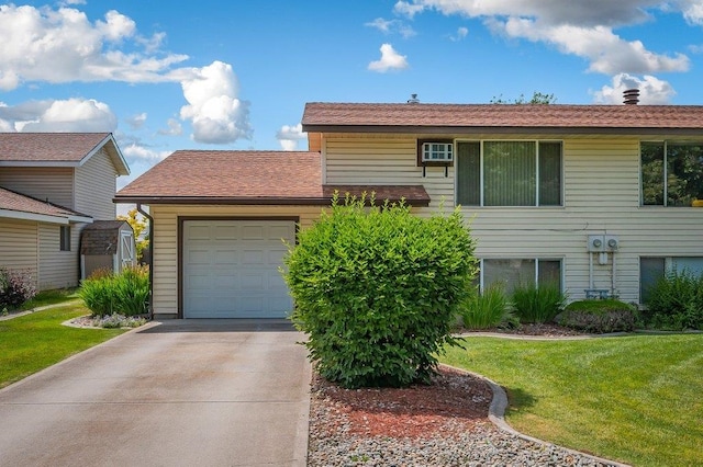 6821 N Hamilton St Unit 1, Spokane, WA 99208 - split level home with driveway, an attached garage, and a front yard