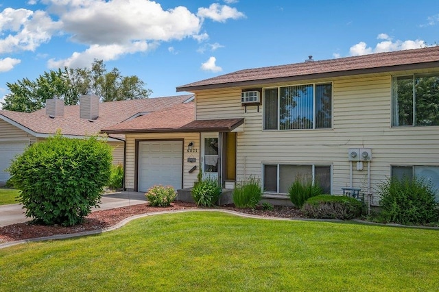 6821 N Hamilton St Unit 1, Spokane, WA 99208 - view of front of property featuring a garage and a front yard