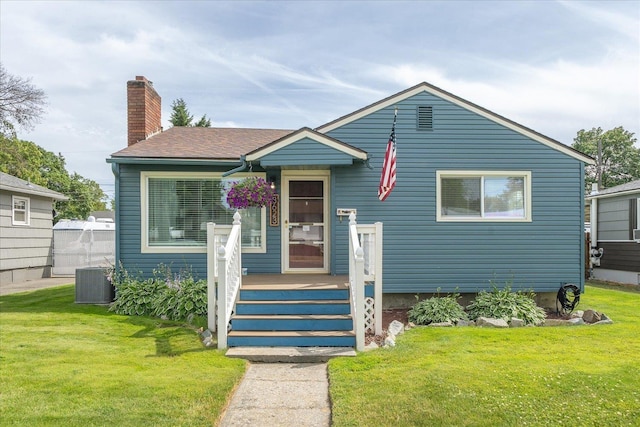 3623 W Longfellow Ave, Spokane, WA 99205 - view of front of house featuring a front yard and a chimney