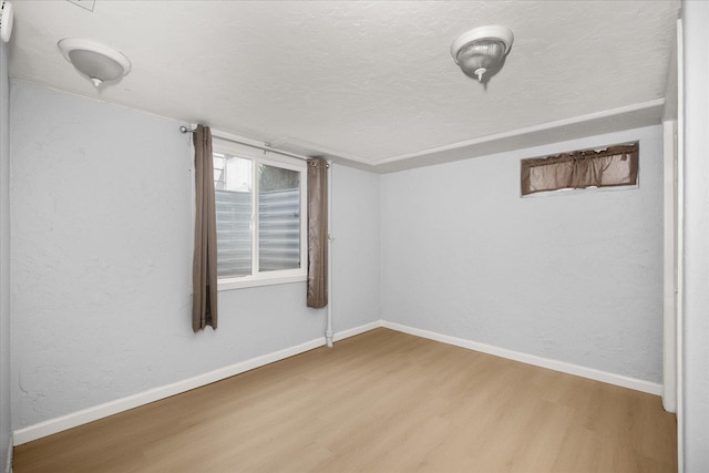 3623 W Longfellow Ave, Spokane, WA 99205 - spare room featuring wood finished floors and a textured ceiling