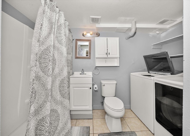 3623 W Longfellow Ave, Spokane, WA 99205 - full bath featuring washer and clothes dryer, tile patterned floors, vanity, and a shower with shower curtain