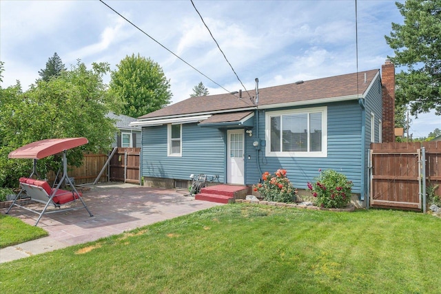 3623 W Longfellow Ave, Spokane, WA 99205 - rear view of house featuring a chimney, a gate, a patio area, and a shingled roof