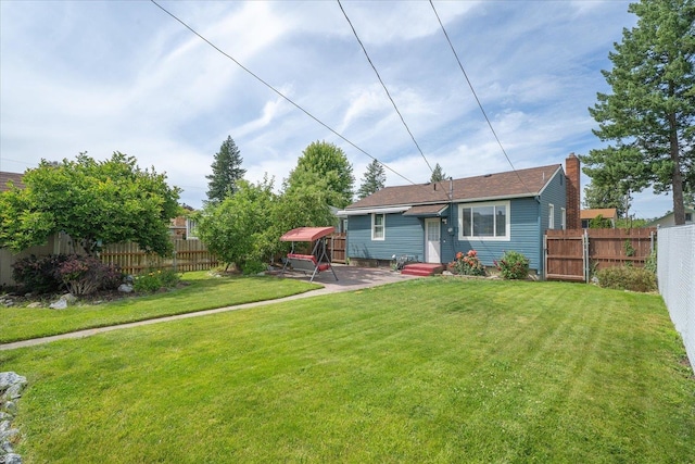 3623 W Longfellow Ave, Spokane, WA 99205 - back of house featuring entry steps, a patio area, and a chimney