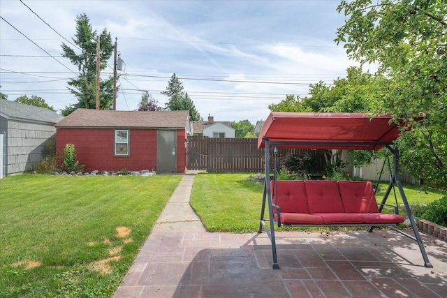 3623 W Longfellow Ave, Spokane, WA 99205 - fenced backyard with a patio, an outdoor structure, and an outdoor living space