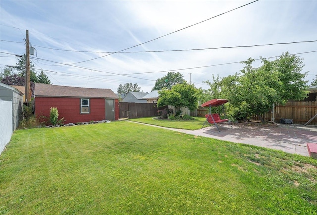 3623 W Longfellow Ave, Spokane, WA 99205 - fenced backyard featuring a patio area and an outbuilding