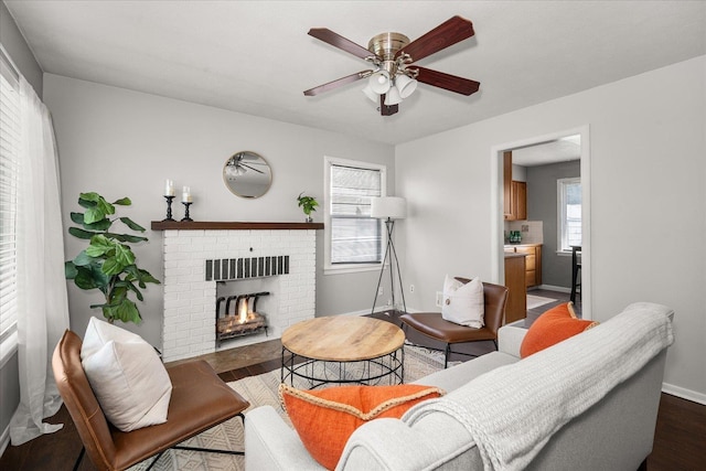 3623 W Longfellow Ave, Spokane, WA 99205 - living area featuring a brick fireplace, ceiling fan, and wood finished floors