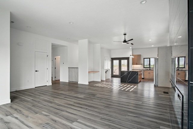 11208 E Rimrock Ln, Spokane Valley, WA 99206 - unfurnished living room featuring wood finished floors, ceiling fan, and recessed lighting