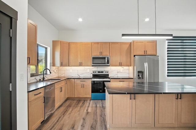 11208 E Rimrock Ln, Spokane Valley, WA 99206 - kitchen featuring appliances with stainless steel finishes, light wood finished floors, dark countertops, light brown cabinets, and recessed lighting