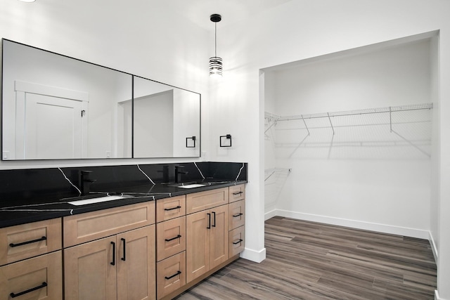 11208 E Rimrock Ln, Spokane Valley, WA 99206 - full bathroom featuring double vanity, wood finished floors, and a walk in closet