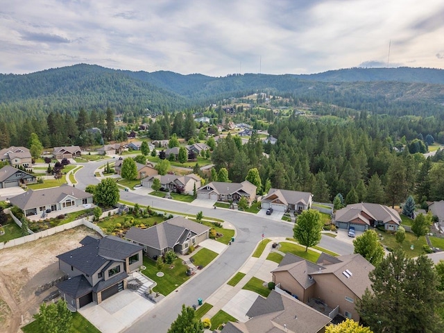 11208 E Rimrock Ln, Spokane Valley, WA 99206 - aerial view of residential area featuring a heavily wooded area and a mountain backdrop