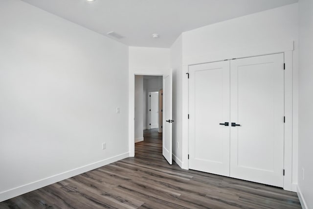 11208 E Rimrock Ln, Spokane Valley, WA 99206 - unfurnished bedroom featuring dark wood-style flooring and a closet