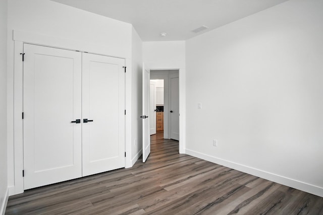 11208 E Rimrock Ln, Spokane Valley, WA 99206 - unfurnished bedroom with wood finished floors and a closet