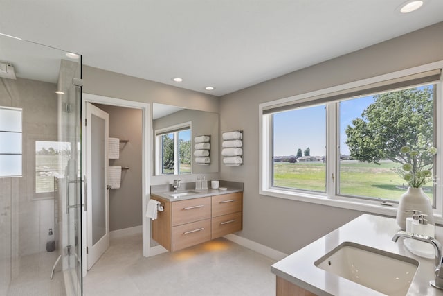 2804 W Johannsen Rd, Spokane, WA 99208 - full bathroom with double vanity, a stall shower, and recessed lighting