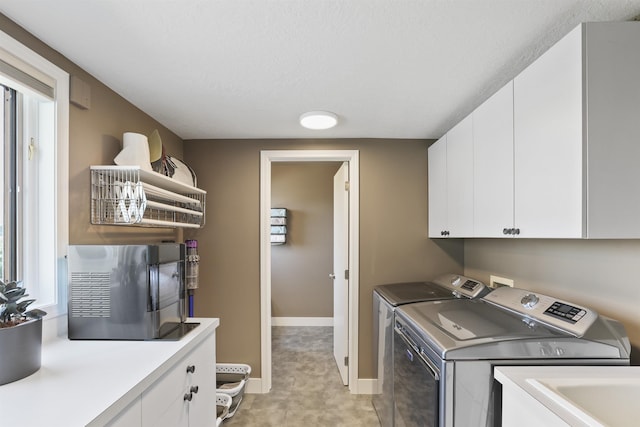 2804 W Johannsen Rd, Spokane, WA 99208 - washroom with cabinet space, independent washer and dryer, and a textured ceiling