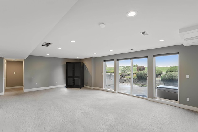 2804 W Johannsen Rd, Spokane, WA 99208 - unfurnished room with light colored carpet, recessed lighting, a smoke detector, and a wall unit AC