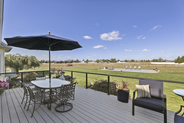 2804 W Johannsen Rd, Spokane, WA 99208 - wooden deck with a swimming pool, a yard, outdoor dining area, and a view of countryside