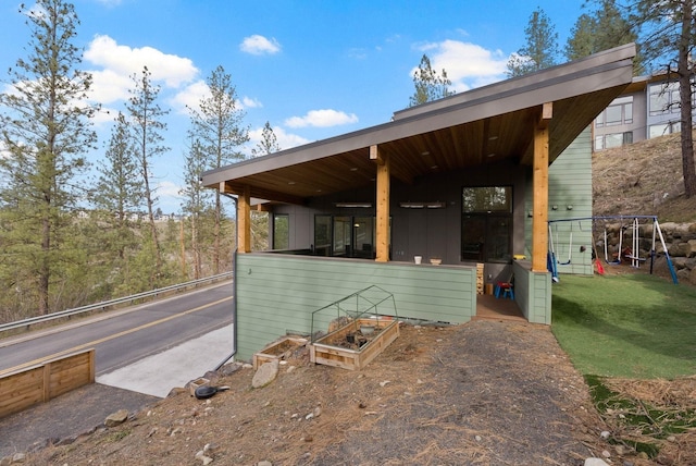 2435 W Riverside Ave, Spokane, WA 99201 - view of side of home with a playground and a lawn