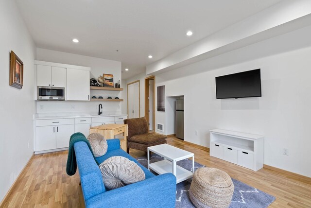 2435 W Riverside Ave, Spokane, WA 99201 - living area with light wood finished floors and recessed lighting
