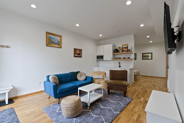 2435 W Riverside Ave, Spokane, WA 99201 - living room with light wood-style floors and recessed lighting