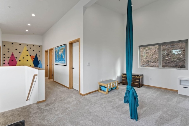 2435 W Riverside Ave, Spokane, WA 99201 - unfurnished bedroom featuring carpet, recessed lighting, and a high ceiling
