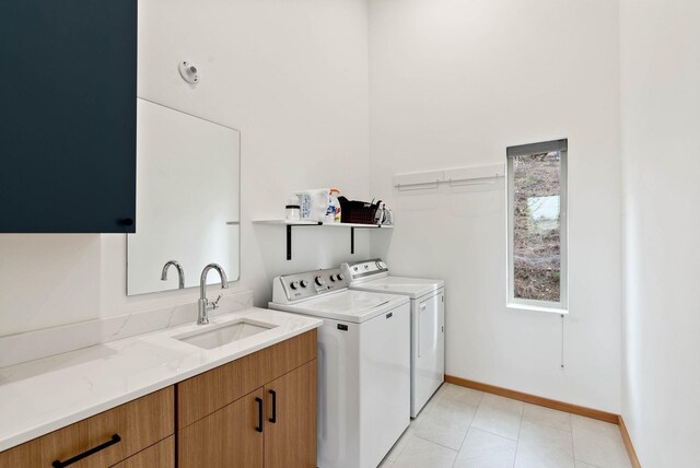 2435 W Riverside Ave, Spokane, WA 99201 - washroom featuring independent washer and dryer and light tile patterned floors