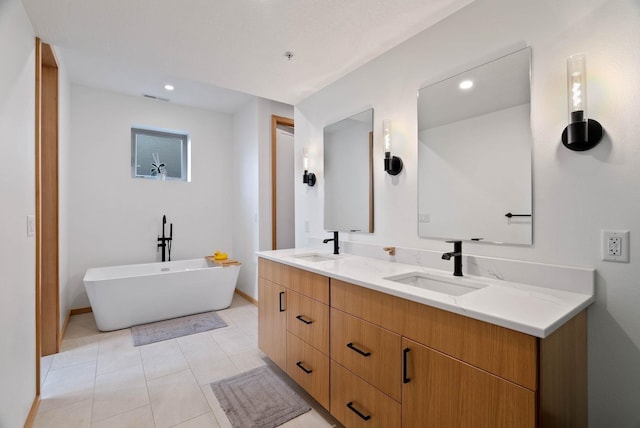 2435 W Riverside Ave, Spokane, WA 99201 - full bathroom with double vanity, a freestanding bath, recessed lighting, and tile patterned flooring