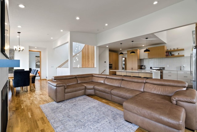 2435 W Riverside Ave, Spokane, WA 99201 - living area with light wood-style flooring, a chandelier, and recessed lighting
