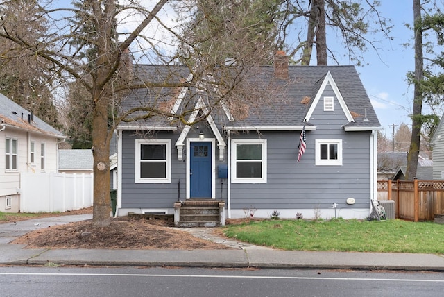107 E 29th Ave, Spokane, WA 99203 - view of front of home with a chimney, a shingled roof, and entry steps
