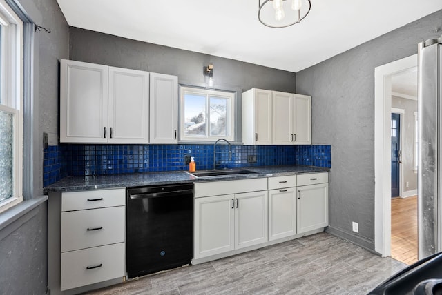 107 E 29th Ave, Spokane, WA 99203 - kitchen featuring black dishwasher, decorative backsplash, a textured wall, dark countertops, and white cabinets