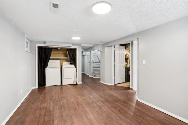 107 E 29th Ave, Spokane, WA 99203 - finished basement featuring stairs, wood finished floors, washer and dryer, and a textured ceiling
