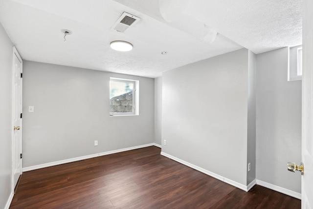 107 E 29th Ave, Spokane, WA 99203 - spare room featuring wood finished floors and a textured ceiling
