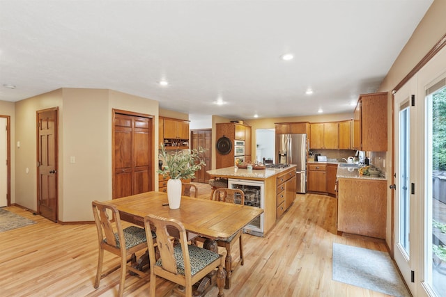 339 W Wilson Ave, Spokane, WA 99208 - dining room featuring beverage cooler, light wood-style floors, and recessed lighting
