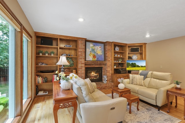 339 W Wilson Ave, Spokane, WA 99208 - living area with light wood-type flooring, a brick fireplace, and recessed lighting
