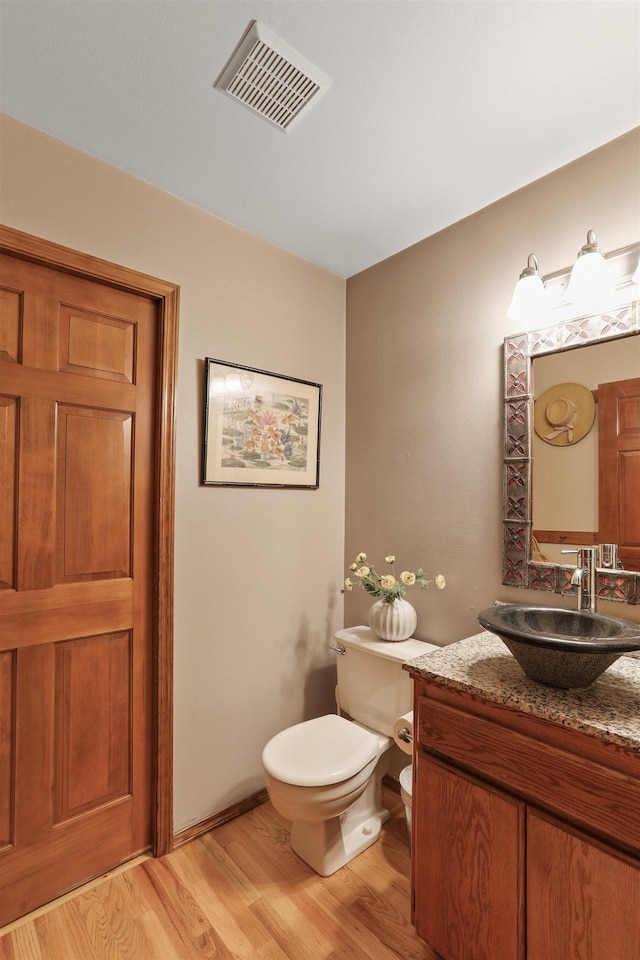 339 W Wilson Ave, Spokane, WA 99208 - bathroom featuring wood finished floors and vanity