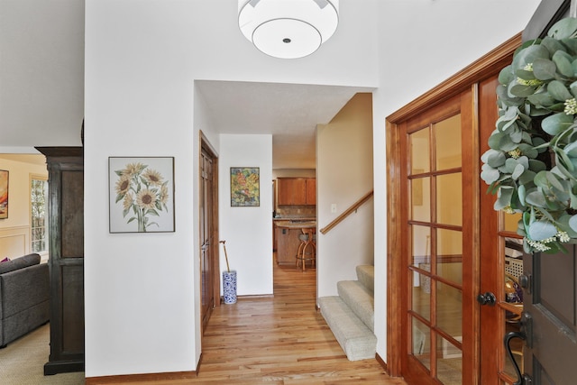 339 W Wilson Ave, Spokane, WA 99208 - foyer with light wood finished floors and stairway