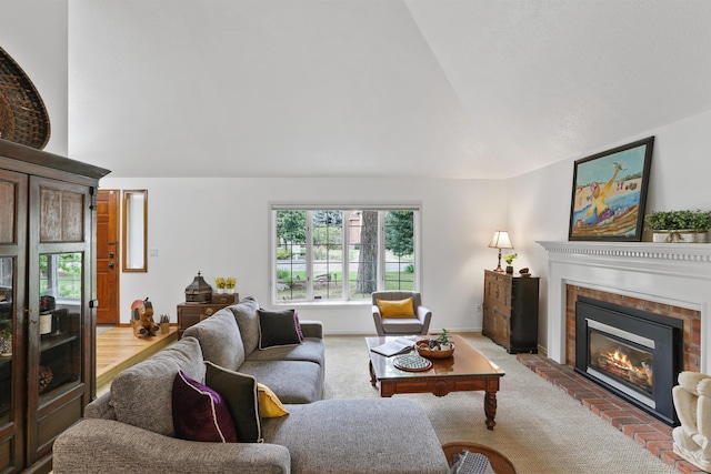 339 W Wilson Ave, Spokane, WA 99208 - living area featuring a fireplace, healthy amount of natural light, carpet floors, and high vaulted ceiling