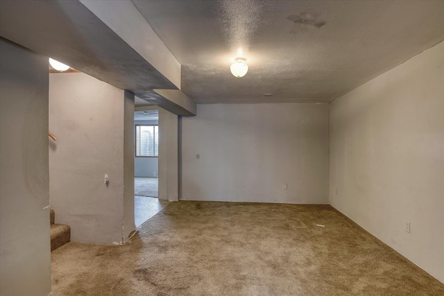 2804 E Marshall Ave, Spokane, WA 99207 - empty room with carpet, stairway, and a textured ceiling