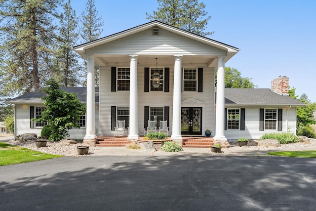 4311 W Center Ln, Spokane, WA 99208 - greek revival inspired property featuring covered porch, a chimney, and a shingled roof