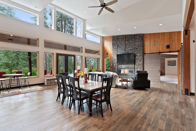 25204 N Lords Ln, Chattaroy, WA 99003 - dining area with a towering ceiling, ceiling fan, wood finished floors, recessed lighting, and a barn door