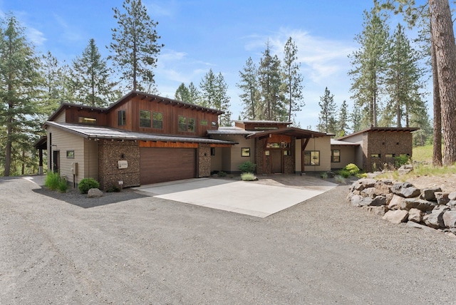 25204 N Lords Ln, Chattaroy, WA 99003 - view of front of home featuring driveway, a garage, and board and batten siding
