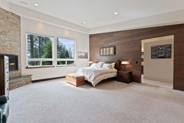 25204 N Lords Ln, Chattaroy, WA 99003 - carpeted bedroom with wood walls, recessed lighting, and a fireplace