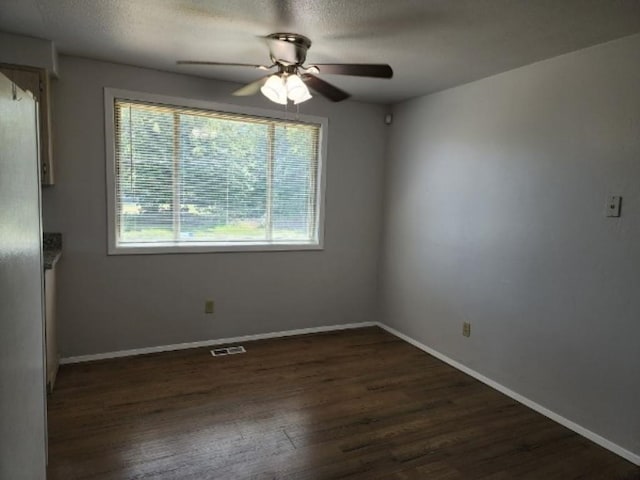 704 E Beacon Ave, Spokane, WA 99208 - spare room featuring a ceiling fan, dark wood-style flooring, and a textured ceiling