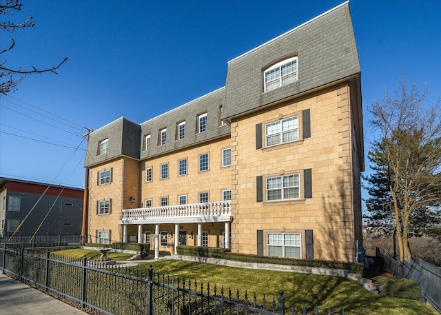 1828 W Riverside Ave Unit 301, Spokane, WA 99201 - view of building exterior with a fenced front yard