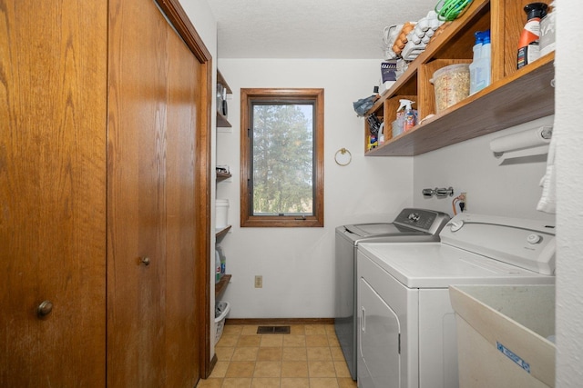 21407 W Baker Rd, Cheney, WA 99004 - laundry area with washing machine and clothes dryer and baseboards