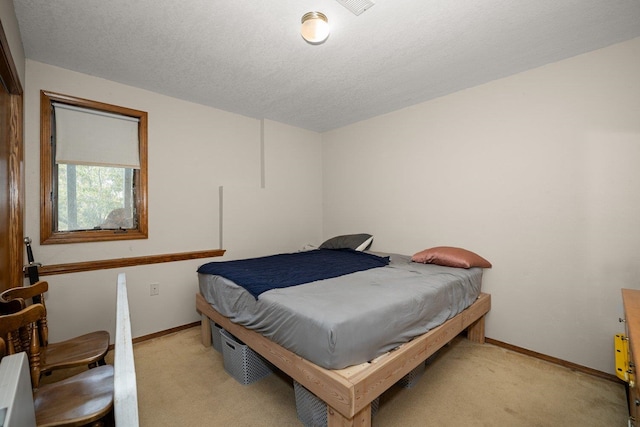 21407 W Baker Rd, Cheney, WA 99004 - bedroom with light carpet and a textured ceiling