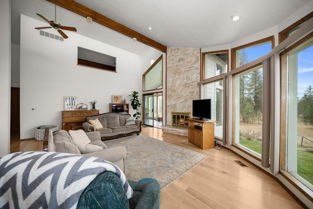 21407 W Baker Rd, Cheney, WA 99004 - living room featuring beam ceiling, light wood-type flooring, ceiling fan, and high vaulted ceiling