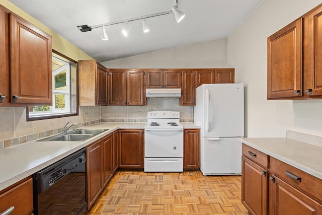 150 E 9th Ave, Kettle Falls, WA 99141 - kitchen with white appliances, under cabinet range hood, vaulted ceiling, rail lighting, and light countertops