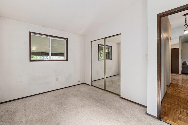 150 E 9th Ave, Kettle Falls, WA 99141 - unfurnished bedroom with carpet flooring, vaulted ceiling, and a closet