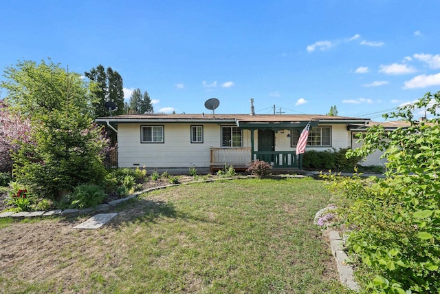 150 E 9th Ave, Kettle Falls, WA 99141 - ranch-style home featuring a porch and a front yard