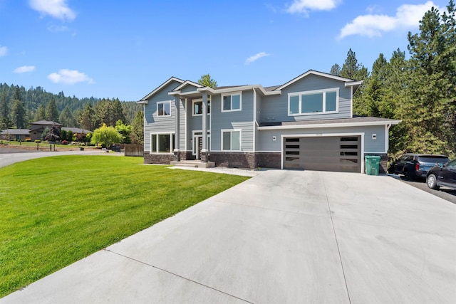 11625 N Alberta Ln, Spokane, WA 99218 - view of front of property with concrete driveway, an attached garage, and a front lawn